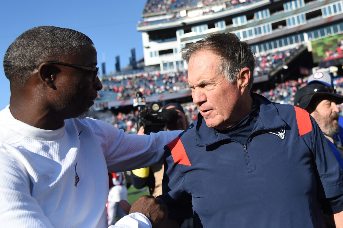 Oct 9, 2022; Foxborough, Massachusetts, USA; New England Patriots head coach Bill Belichick and Detroit Lions defensive coordinator Aaron Glenn meet at midfield at Gillette Stadium.